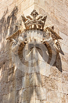 Valencian coat of arms worn by two angels on the facade of the Silk Exchange La Lonja de la Seda