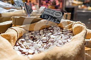 Valencian garrofon in a sack at a vegetable stall in the market. Close up shot. photo