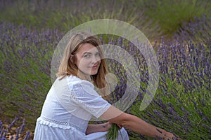 Valensole, France. Woman in floral field of lavender