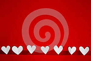 Valentine background with copy space concept, white hearts on red backgrounds with text for space