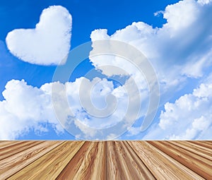 Valentine background. Wooden board table top over blue sky with