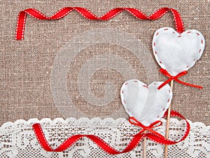 Valentine card with textile hearts and lacy cloth