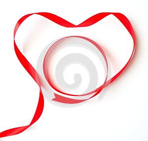 Valentine concept, Red heart ribbon decorated on white background-top view