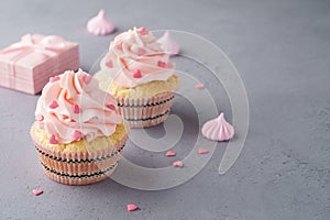 Valentine cupcakes decorated with sweet hearts and a gift box