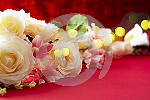 Valentine Day abstract background with white roses and red hearts over red background with copy space