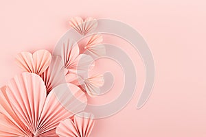 Valentine day background - flow of flying gentle pink paper ribbed hearts on soft light pink background, top view, copy space.