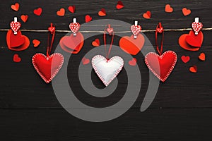 Valentine day background, pillow hearts border on wood, copy space