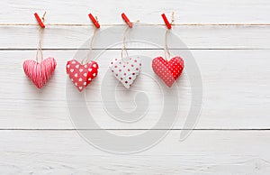 Valentine day background, pillow hearts border on wood, copy space