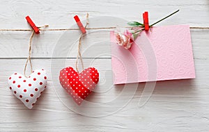 Valentine day background, pillow hearts border on wood, copy space