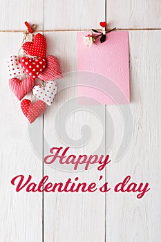 Valentine day background, pillow hearts border on wood, copy space