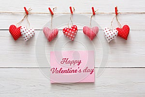 Valentine day background, pillow hearts border on wood, copy space