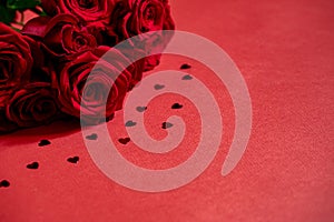 Valentine day background with red hearts and roses, top view
