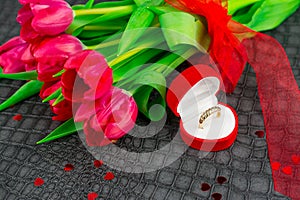 valentine day background  with  tulips and gold ring