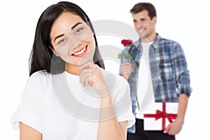 Valentine day. Boyfriend with flowers and gift box. Beautiful asian girl with healthy skin isolated on white background. Young