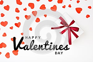 Valentine day composition: .gift boxe with bow and red hearts, photo template, background. Top View