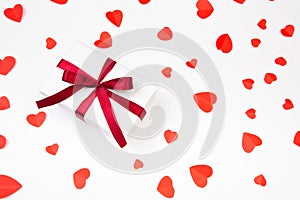 Valentine day composition: .gift boxe with bow and red hearts, photo template, background. Top View