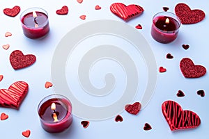 Valentine day composition: red love hearts, romantic gift box, candle on white background. February romance present card