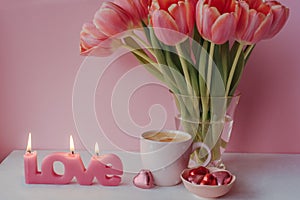 Valentine day with cup of coffee, chocolate and candle