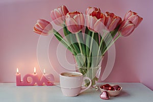 Valentine day with cup of coffee, chocolate and candle