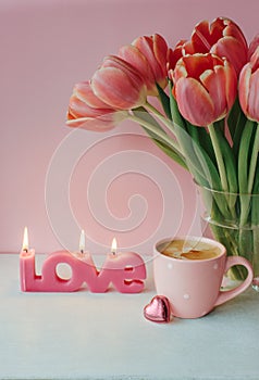 Valentine day with cup of coffee, chocolate and candle