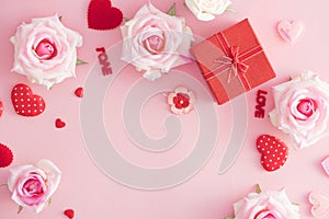 Valentine Day gift box with red hearts and roses on pink background