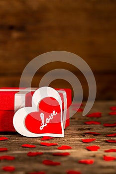 Valentine day gift box with red and white wooden heart shape