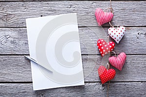 Valentine day letter background, hearts bunch on wood