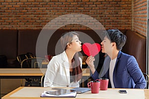 Valentine Day man gave the red heart to girl to show love