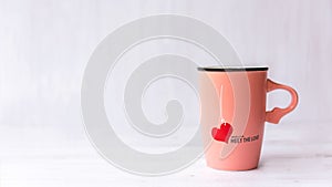 Valentine Day with pink cup coffee red heart on the cup,