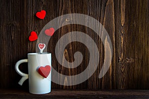 Valentine Day with red cup coffee Sewed pillow hearts row border, old wood background,