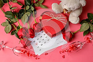 Valentine day. Red hearths and roses on Calendar page. February 14 of Saint Valentines day. Pink background.