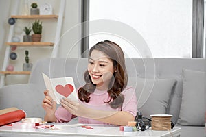 Valentine day theme. Beautiful romantic woman making present for her couple