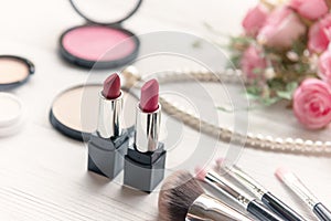 Valentine Gift. Makeup cosmetics tools background and beauty cosmetics, products and facial cosmetics package lipstick with pink r
