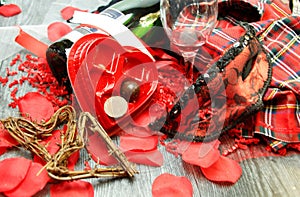 Valentine heart chocolates to anyone`s heart, wine,  mask, plaid lingerie, red confetti, ribbons,