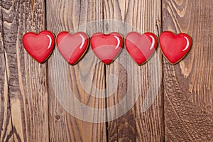 Valentine heart gingerbread on wooden background. Valentine`s day card.