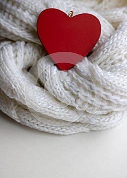 Valentine heart on a white scaf. Background for Valentines day greeting card, concept of romantic celebration.winter