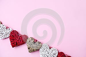 Valentine hearts on pink background with copy space. Symbols of love in shape of heart for Happy Valentine`s , Women`s, Mother`