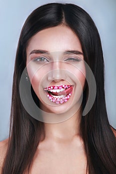 Valentine Hearts sweet makeup. Valentine`s Day make-up lips with pink hearts sugar sprinkles. Kiss on the Lips