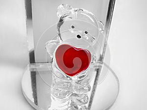 Valentine I love you red heart and teddy bear figurine standing on glass mirror