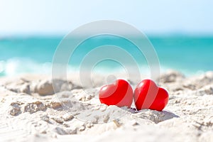 Valentine and Marry Concept. Two red hearts couple lovers for married on the sand summer beach,