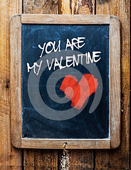 Valentine message on vintage chalkboard