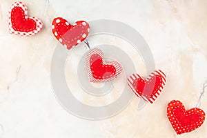 Valentine`s Background with Handmade Red Sewed Pillow Hearts in Row