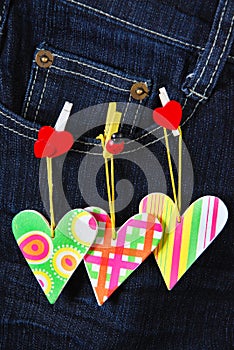 Valentine`s card with hearts on denim pocket