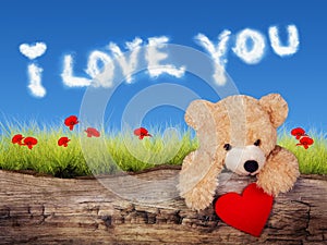 Valentine`s card with teddy bear with heart and love clouds