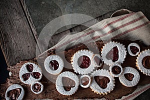 Valentine's cookies on wood table with napkin and metal photo