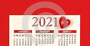 Valentine\'s Day 2021 calendar design on red background with heart, template or mockup concept