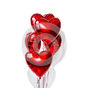 Valentine`s Day. Air balloons. Bunch of red heart shaped foil balloons isolated on white