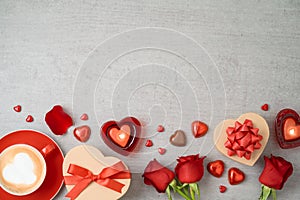 Valentine`s day background with coffee cup, heart shape chocolate, candles, rose flowers and gifts