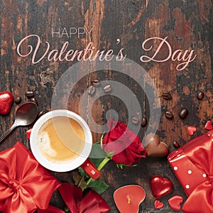 Valentine's day background with fresh cup of coffee, red roses, chocolate and gifts