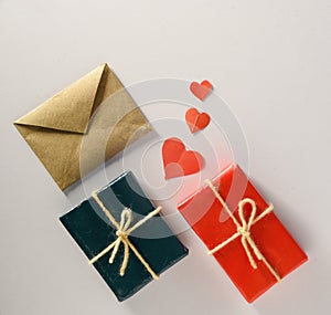 Valentine's Day background. Gifts, candle, confetti, envelope on pastel white background. Valentines day concept.